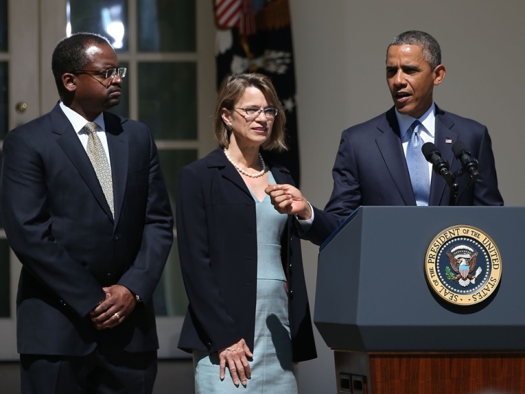 President Barack Obama gestures while nominating Cornelia T. L. Pillard (C), a law professor, and Robert L. Wilkins (L), a federal district judge, to become federal judges, during an event in the Rose Garden at the White House June 4, 2013 in Washington, DC.