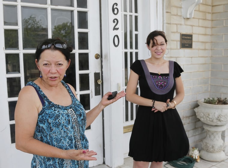 Elba Kufdakis, left, and daughter Susan Kufdakis speak outside the historic Brady Mansion in Tulsa, Okla., on June 27.
