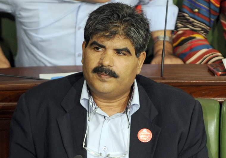 Tunisian opposition figure Mohamed Brahmi , seen in October 2012, was shot dead after he went outside following a phone call, his wife said.