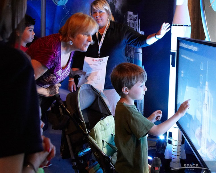 Children explore the interactive exhibits at the Intrepid Museum's SpaceFest.