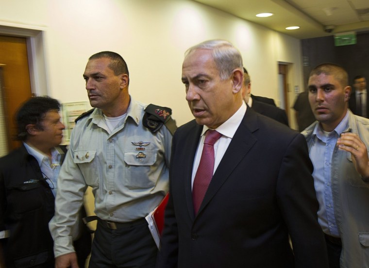 Israel's Prime Minister Benjamin Netanyahu arrives for the weekly cabinet meeting in Jerusalem on July 28, 2013. During the meeting, Netanyahu's cabinet approved a divisive Israeli decision to release 104 Arab prisoners in order to restart peace talks with the Palestinians.