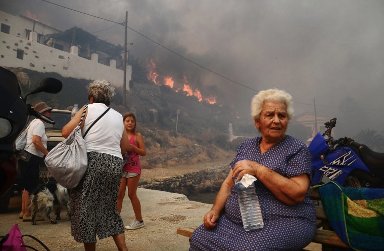 People evacuate the village of Megalo Livadi on Serifos, July 27.