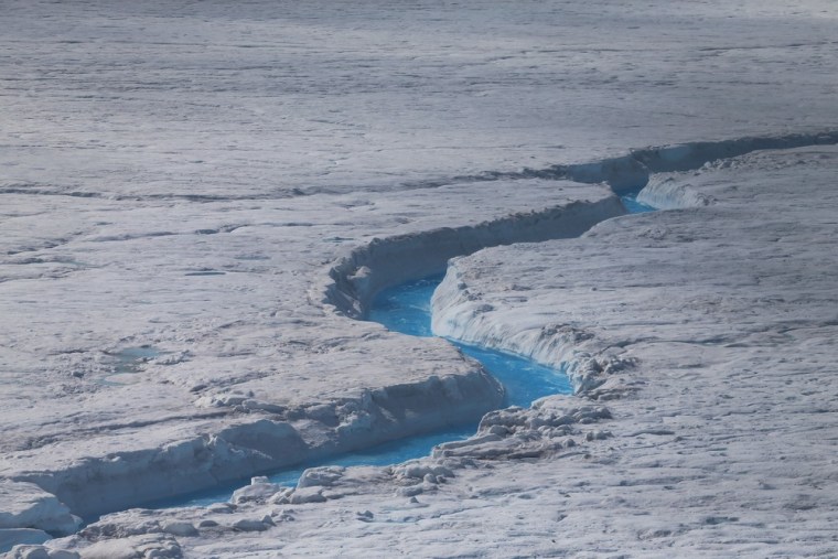 Water is seen on part of the glacial ice sheet that covers about 80 percent of Greenland on July 17.