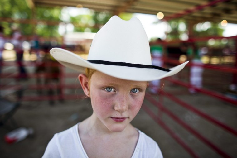 Seven-year-old Kaylin Helms is pictured before leading her cow into the kiddie dairy competition during the Great Jones County Fair and Food Fest in Monticello on July 17.