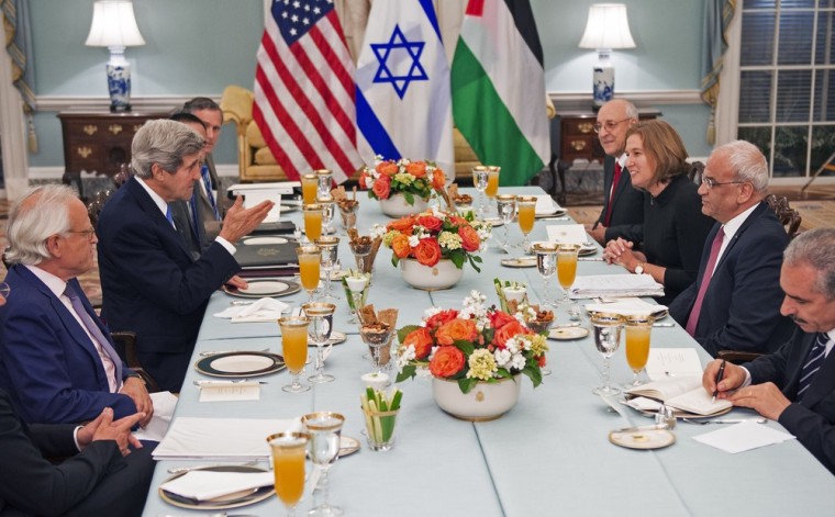 Secretary of State John Kerry (center-left) hosts a dinner with Israeli Justice Minister Tzipi Livni (right 2nd from end) and Palestinian chief negotiator Saeb Erakat (3rd) in the Thomas Jefferson Room of the Department of State Monday.