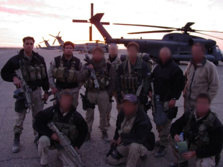 Brandon Webb is seen to the right of former SEAL and astronaut Chris Cassidy in a photo shot in Kandahar, Afghanistan in 2001.