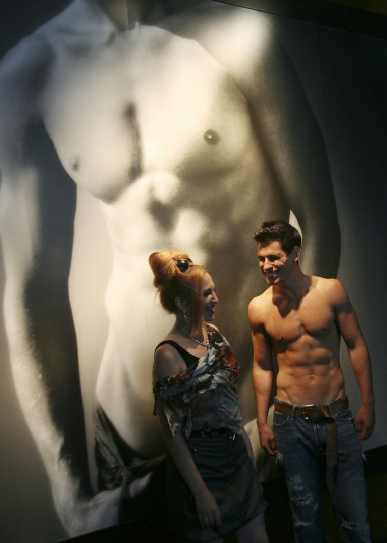 In this Aug 12, 2008 file photo, a male model greets a shopper at Abercrombie & Fitch in New York.