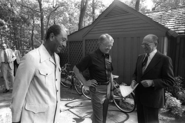 Israeli Prime Minister Menahem Begin, right, talks with with Egyptian President Anwar Sadat and U.S. President Jimmy Carter during their peace talks on Sept. 6, 1978 at Camp David.
