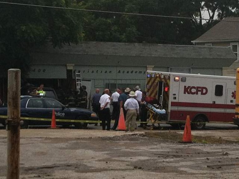 An ambulance outside the Christian Academy Daycare in Kansas City, Mo., after a car crashed into the building.