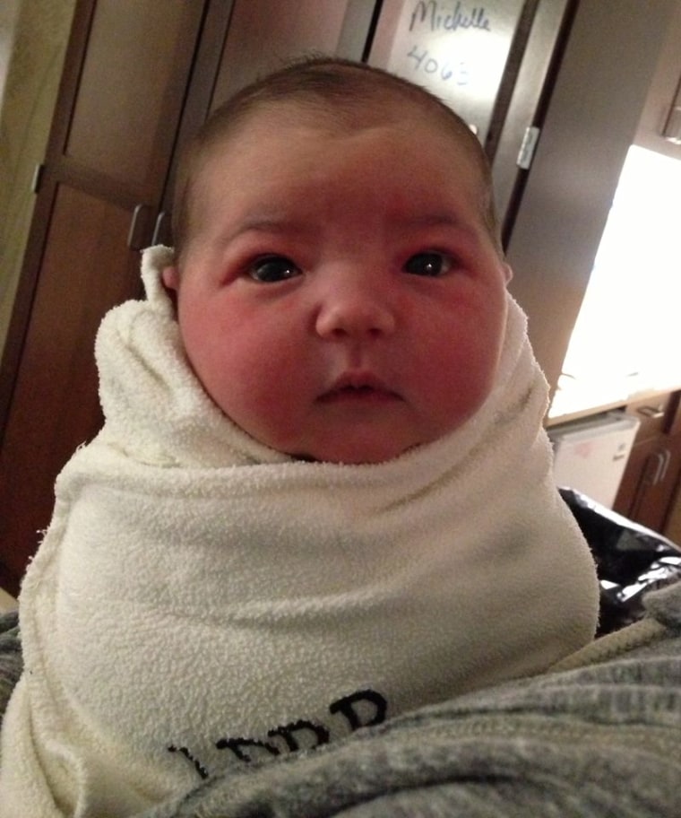 Baby Burke weighed 9 pounds, 4 ounces. Look at those cheeks!