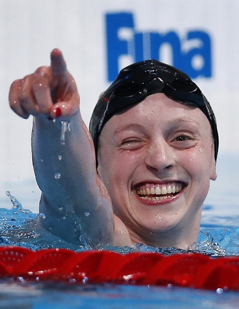 Katie Ledecky of the United States celebrates after winning the gold medal in the Women's 1500m freestyle final. Ledecky set a new word record of 15:36.53.