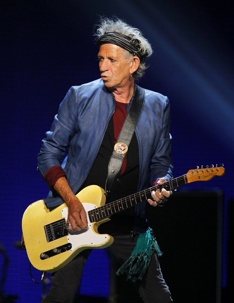 Keith Richards of British rock band The Rolling Stones performs during their \"50 & Counting\" worldwide tour in Anaheim, California May 18, 2013. REUTE...