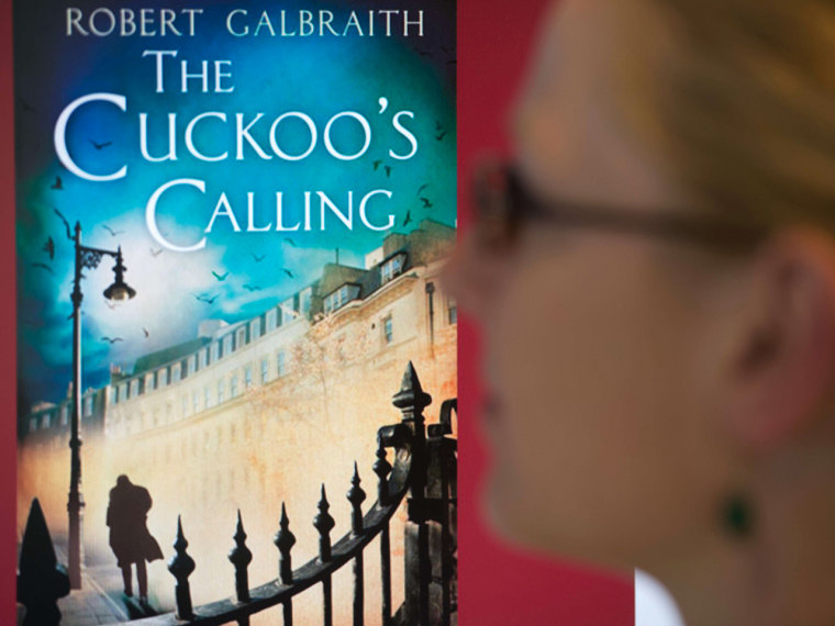 A young woman looks at a computer screen showing the cover of \"The Cuckoo's Calling,\" written by J.K. Rowling under the penname, Robert Galbraith.