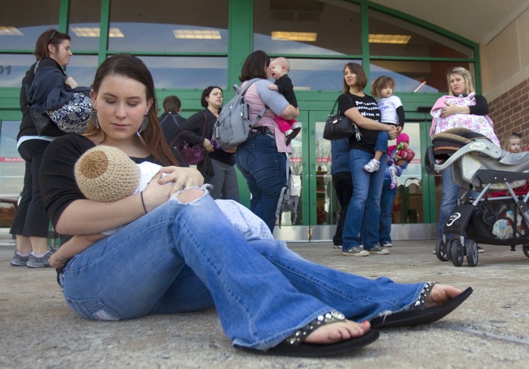 Brittany Hinson breast feeds her 4-month-old son, Kennedy, during a nurse-in in front of a Texas store in 2011,