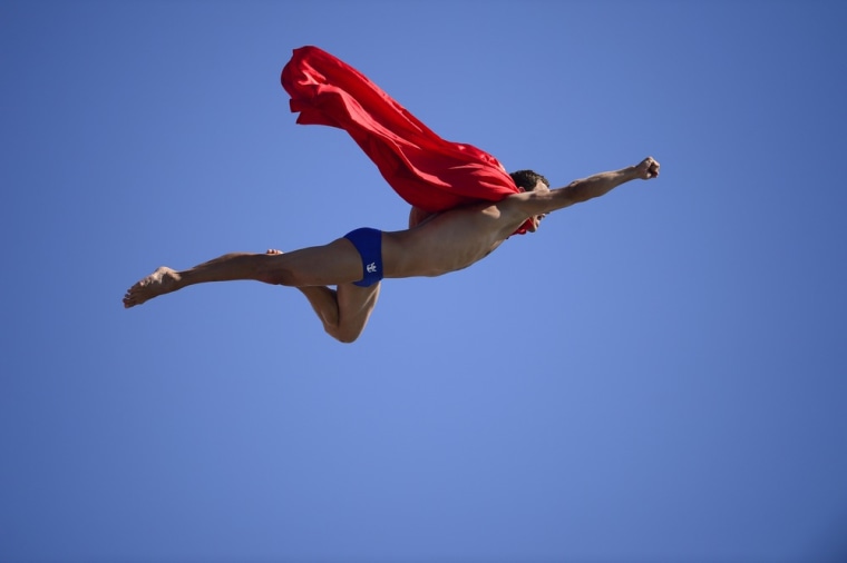 Czech Michal Navratil dives as superman after the men's high diving final competition completed at the FINA World Championships in Moll de la Fusta port in Barcelona on July 31. Navratil took fourth place at the event.
