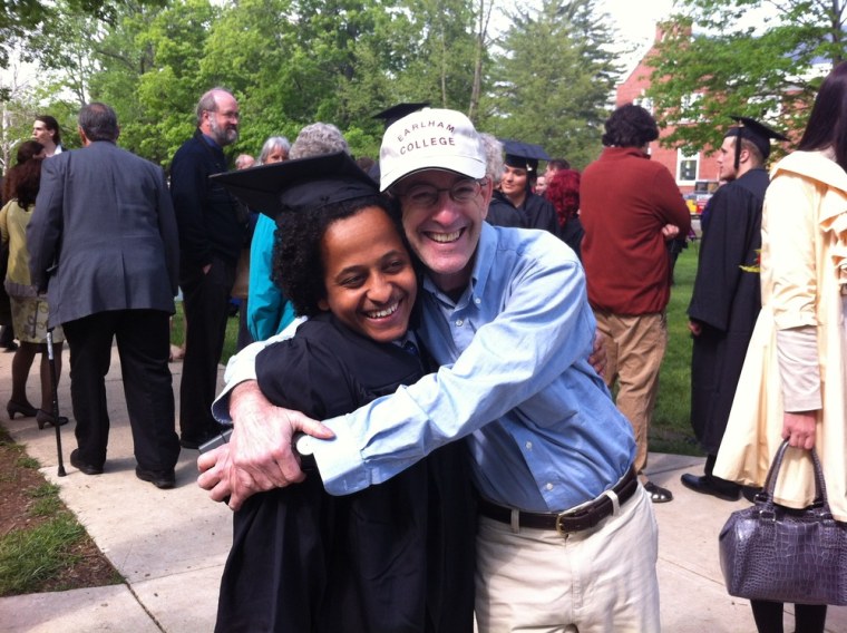 Dr. Rick Hodes embraces Semegnew Hodes at his college graduation from Earlham College in Richmond, Ind., on May 9, 2013.