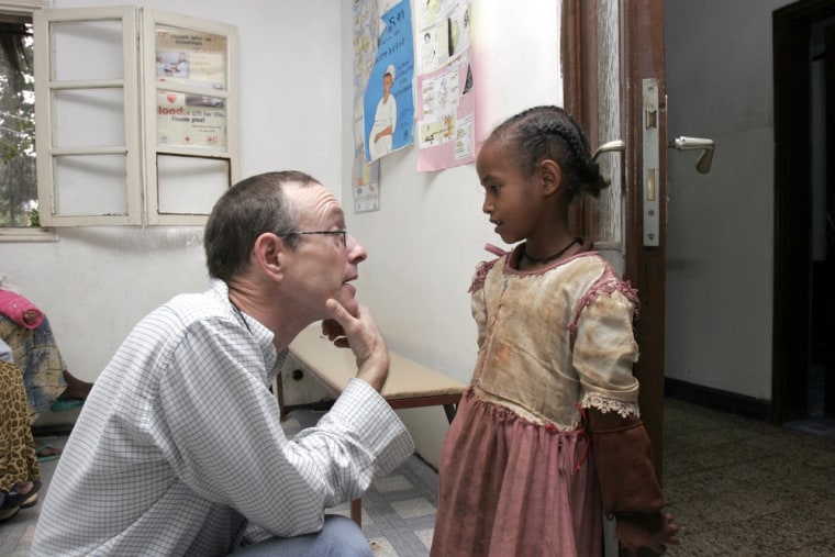 Dr. Rick Hodes talks with girl at the Blue Nile Medical Clinic in Addis Ababa, Ethiopia.