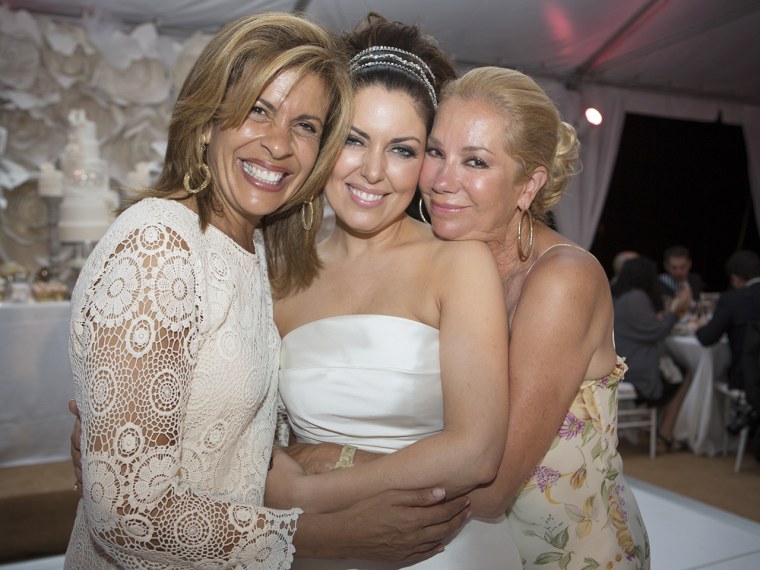 Hoda Kotb, Bobbie Thomas and Kathie Lee Gifford embrace on the reception dance floor.