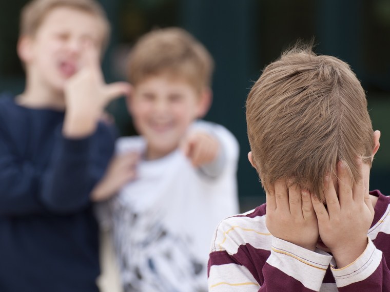 Elementary Student Hides His Face While Being Bullied