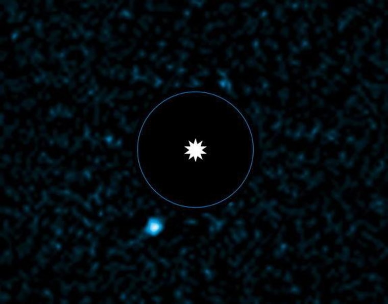 This image from ESO's Very Large Telescope shows the newly discovered planet HD 95086 b, next to its parent star in this Image released on Monday.