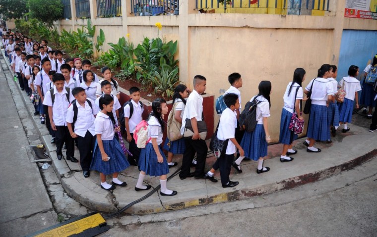 Tears flow on Filipino kids' first day at school