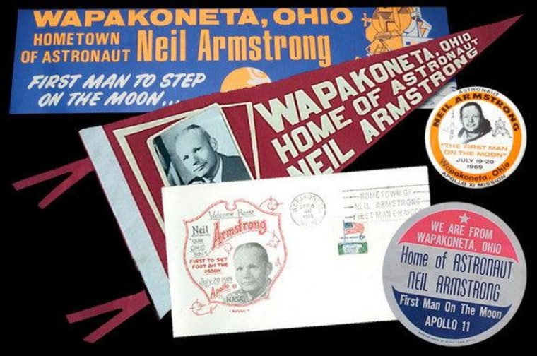 Vintage memorabilia celebrating Neil Armstrong's connection to Ohio and his hometown of Wapakoneta. The first moonwalker's Ohio accent may have led to his famous first words on the moon being misheard.