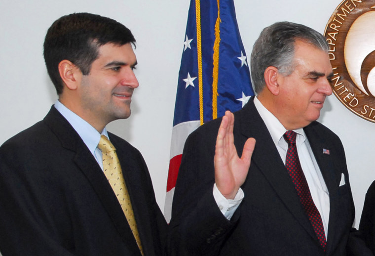 Sam Lahood, left, seen as his father Ray is sworn in as Transportation Secretary in January 2009, was sentenced in absentia to five years in prison in Egypt.