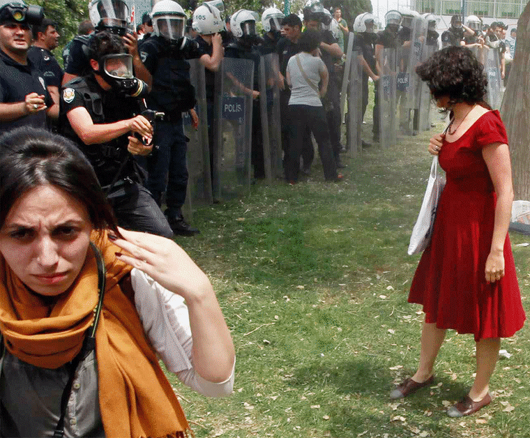 'Woman in red' sprayed with teargas symbol of Turkey protests