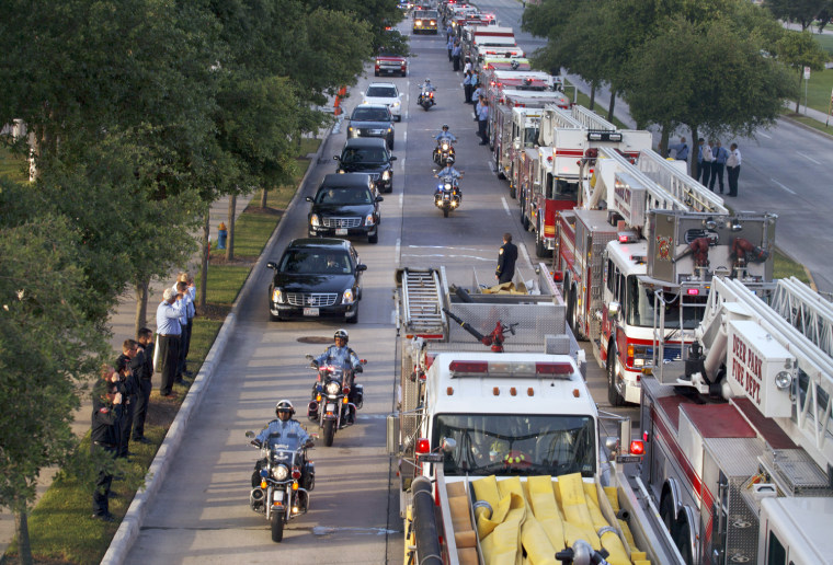 Dozens of fire trucks and emergency services vehicles from New Orleans, Dallas and elsewhere formed a long procession on flag-lined streets leading to Reliant Stadium.
