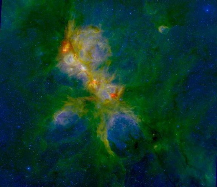In this false-color image of NGC 6334, red represents the Herschel 70 micron IR image, green represents the IRAC 8 micron image and blue represents the NEWFIRM 1 micron J band. The region is about 70 light years wide.