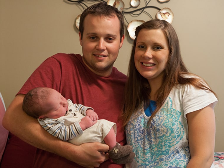Josh and Anna Duggar with new son Marcus Anthony.