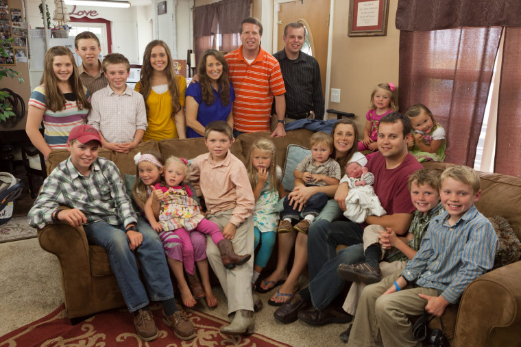 The whole Duggar family meets baby Marcus, who is in his father's arms.