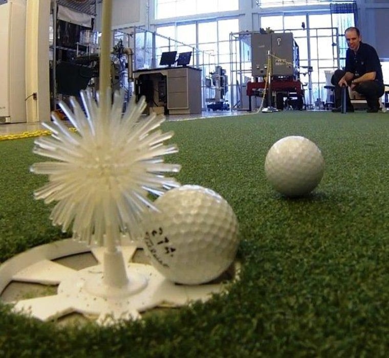 USGA senior research engineer Steve Quintavalla lets a golf ball roll at the association's Research and Test Center in Far Hills, N.J. Quintavalla is one of the experts appearing in the