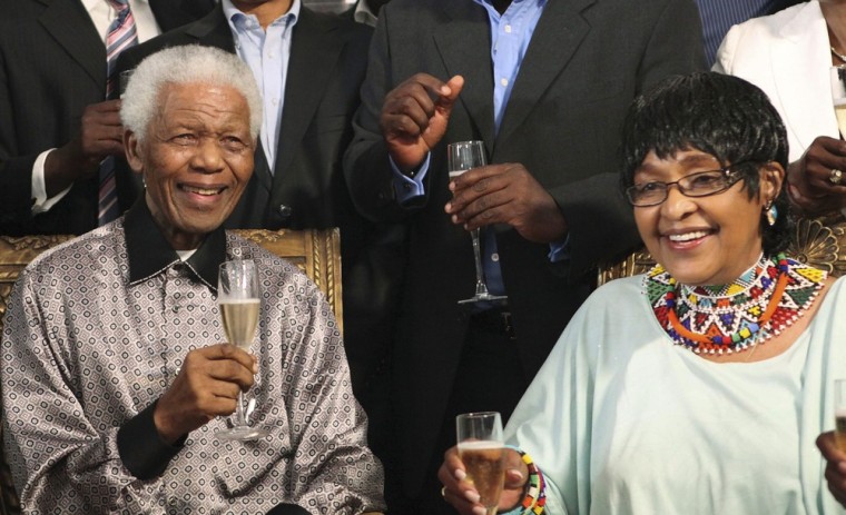 South Africa's former President Nelson Mandela, along with his ex-wife Winnie Madikizela-Mandela and former members of the National Reception Committee, celebrate the upcoming 20th anniversary of his release from prison in Johannesburg on Feb. 4, 2010.