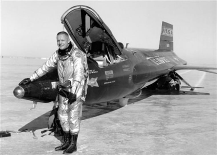 This 1960 image provided by NASA shows Neil Armstrong standing by an X-15 rocketplane after a test flight. Armstrong later went on to become the first man to walk on the moon.