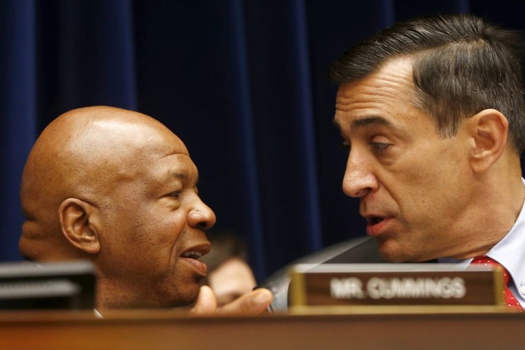 House Oversight and Government Reform Committee Chairman Rep. Darrell Issa, R-Calif., right, talks with the committee's ranking Democrat Rep. Elijah Cummings, D-Md. on Capitol Hill in Washington, Thursday, June 6, 2013, during the committee's hearing regarding IRS conference spending.