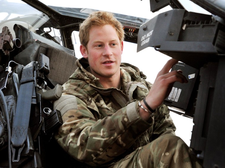 CAMP BASTION, AFGHANISTAN - DECEMBER 12:  In this image released on January 21, 2013, Prince Harry makes early morning checks as he sits on an Apache ...