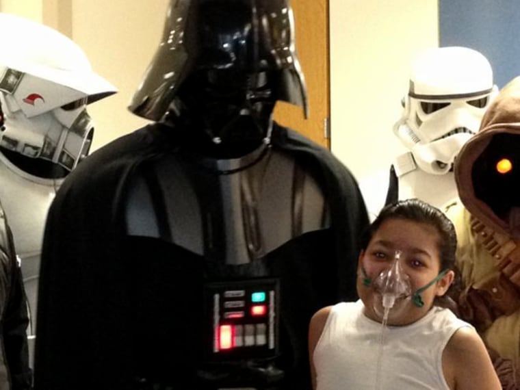 Javier Acosta, age 11, poses with Star Wars characters as he waits for a lung transplant at Children's Hospital of Philadelphia. Organ transplant officials have tweaked a policy to allow children like Javier appeal for special consideration.