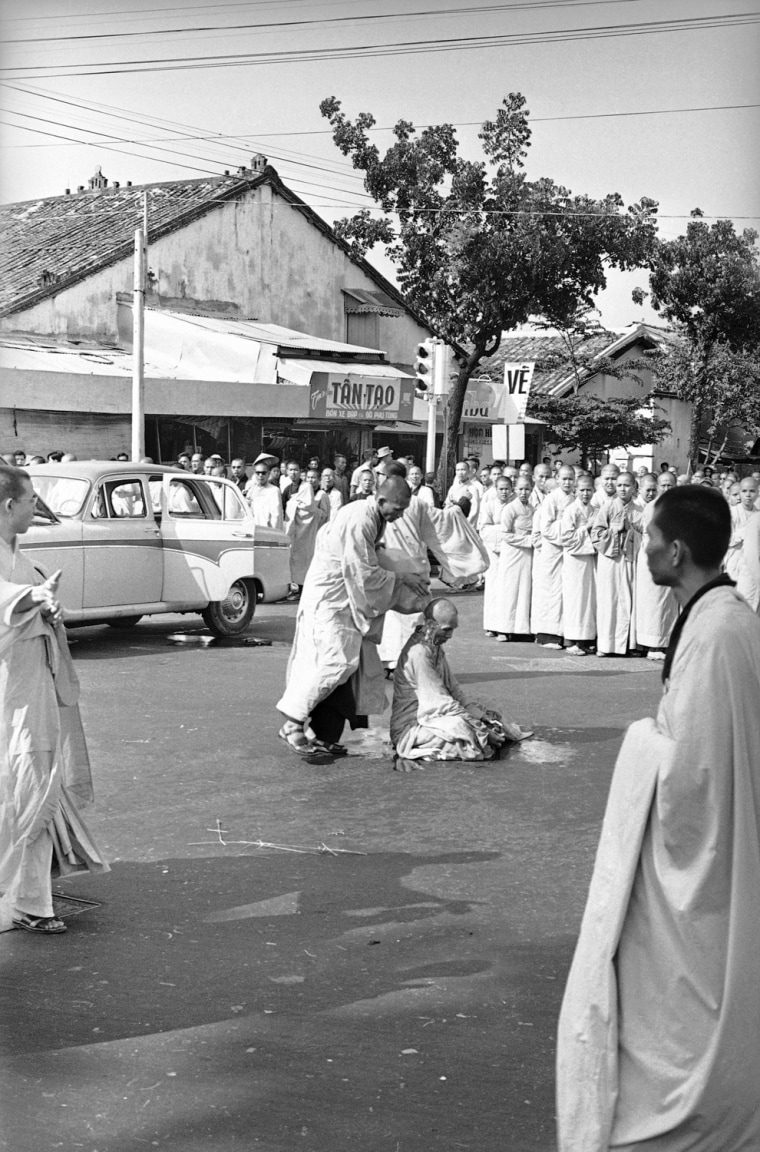 Buddhist monk Thich Quang Duc is doused with gasoline during a demonstration in Saigon.