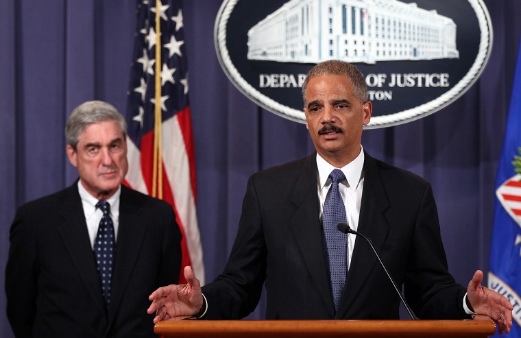 U.S. Attorney General Eric Holder, right, and FBI Director Robert Mueller at a news conference on Oct. 11, 2011.