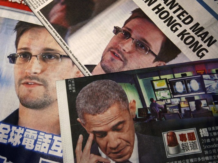 Photos of Edward Snowden, a contractor at the National Security Agency, and U.S. President Barack Obama are printed on the front pages of local English and Chinese newspapers in Hong Kong in this photo illustration.