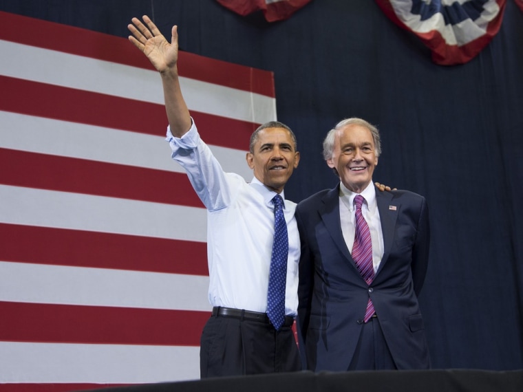 President Barack Obama, accompanied by Massachusetts Democratic Senate candidate, Rep, Ed Markey, waves to the crowd during a campaign rally for Markey in Boston, Wednesday, June 12, 2013.