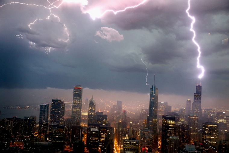 Lightning strikes the Willis Tower, formerly Sears Tower, in downtown Chicago on June 12, 2013. A massive storm system with heavy rain, high winds, hail and possible tornadoes moved into Illinois and much of the central part of the Midwest on Wednesday.
