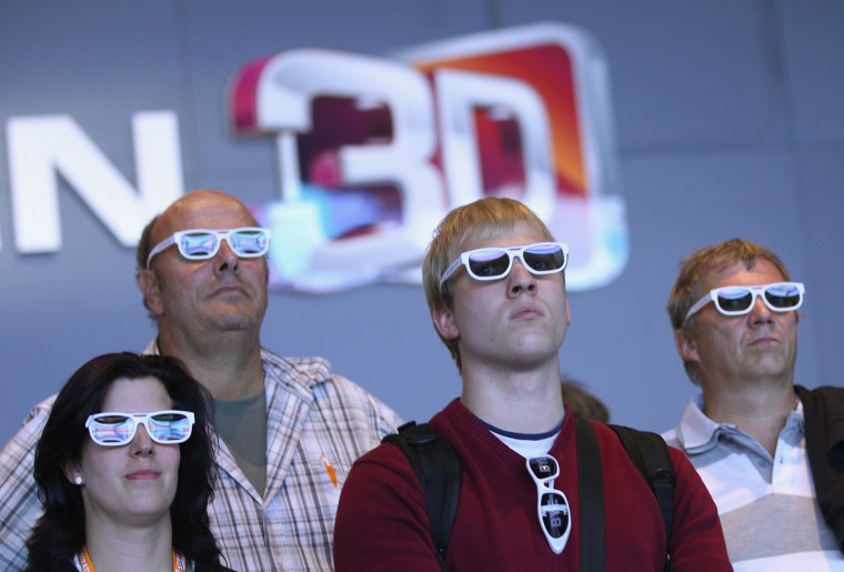 Visitors wear 3D glasses while watching a presentation of 3D Smart TV at the LG stand at the IFA 2011 consumer technology trade fair on the first day of the fair's official opening on September 2, 2011 in Berlin, Germany.