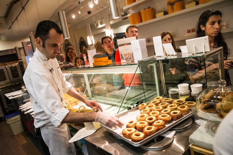 NEW YORK, NY - JUNE 10:  Chef Dominique Ansel packages croissant-doughnut hybrids (known as \"cronuts\") at Dominique Ansel Bakery on June 10, 2013 in N...