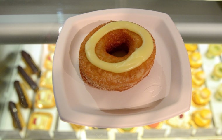 A cronut, a croissant-doughnut hybrid, the brain child of French pastry chef Dominique Ansel, sits on a plate at Ansel's bakery shop in New York on Ju...