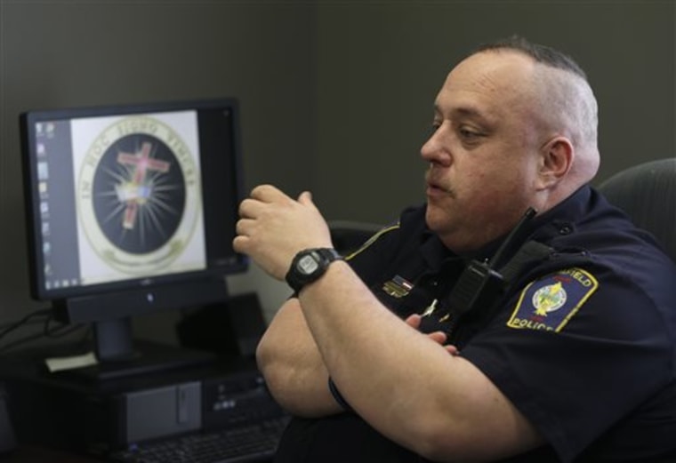 In this Tuesday, April 2, 2013 photo shows Brimfield Police Chief David Oliver talking about his facebook page in Kent, Ohio. Oliver uses the reach of...