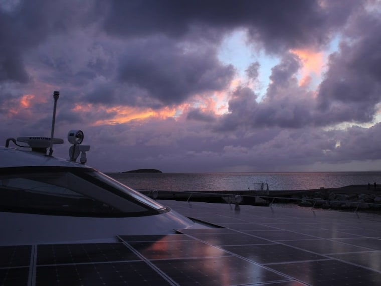 The catamaran catches an early sunrise off the coast of St. Martin in the West Indies on May 21 this year.