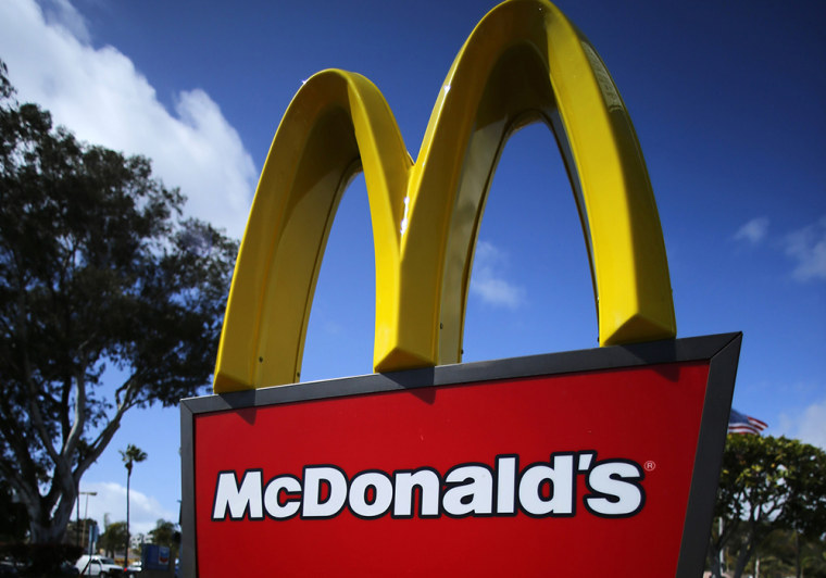McDonald's owners in Pennsylvania are being sued by a former employee who says she was given a fee-laden debit card to access hear earnings.