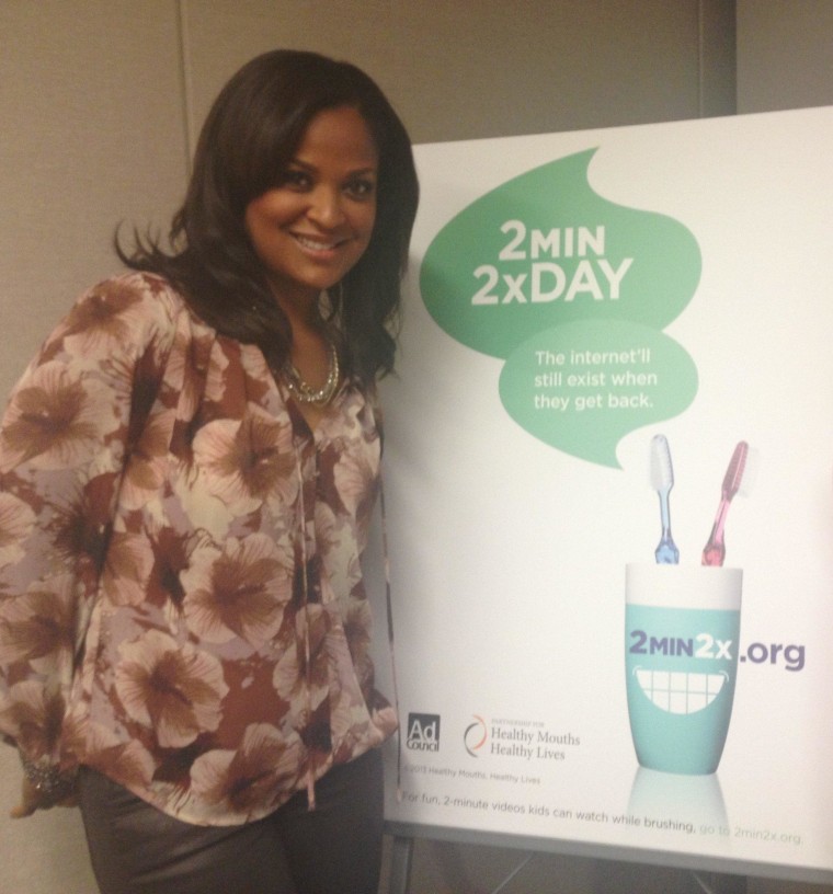 Laila Ali poses with a poster from the